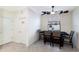 Bright dining area features modern light fixture, stylish decor, and tile floors at 3512 Scrub Creek Run, Lakewood Ranch, FL 34211