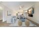 Bright and open living room with a comfortable seating area, modern décor, and seamless flow to the kitchen at 3512 Scrub Creek Run, Lakewood Ranch, FL 34211