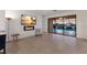 Cozy living area boasts a sleek fireplace and large sliding doors to the inviting pool area at 3512 Scrub Creek Run, Lakewood Ranch, FL 34211