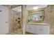 Elegant bathroom with a walk-in tiled shower, stylish vanity, and spa-like atmosphere at 3522 Ferndell, Sarasota, FL 34235