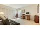 Spacious room featuring a wooden desk, chair, sofa and large closet with sliding doors at 3522 Ferndell, Sarasota, FL 34235