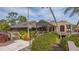 Exterior view of the clubhouse, highlighting its well-maintained landscaping and inviting entryway at 3522 Ferndell, Sarasota, FL 34235