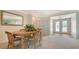 Inviting dining area with carpet flooring, and bright lighting from the front double-door entry at 3522 Ferndell, Sarasota, FL 34235