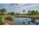 Picturesque view of the golf course and driving range with water features, providing a serene golfing experience at 3522 Ferndell, Sarasota, FL 34235