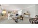 Relaxing living room featuring neutral colors, a stylish coffee table, and a comfortable couch at 3522 Ferndell, Sarasota, FL 34235
