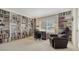 Spacious home office with custom built-in bookshelves, an office chair, and natural light at 3522 Ferndell, Sarasota, FL 34235
