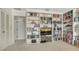Office/den space showcasing custom built-in bookcases and an area for a television at 3522 Ferndell, Sarasota, FL 34235