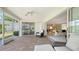 Covered patio area with views into the living room and dining room area through sliding glass doors at 3522 Ferndell, Sarasota, FL 34235