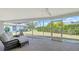 Enclosed patio with a seating area and an open view of the backyard and landscaping at 3522 Ferndell, Sarasota, FL 34235