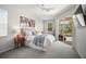 Relaxing main bedroom with plush carpet, a sliding door to lanai, and serene outdoor views at 358 River Enclave Ct, Bradenton, FL 34212