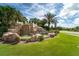 A stone waterfall feature with the words 'River Strand' welcomes you to the community at 358 River Enclave Ct, Bradenton, FL 34212