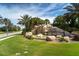 The 'River Strand' waterfall feature makes for a grand and tropical entrance to the neighborhood at 358 River Enclave Ct, Bradenton, FL 34212