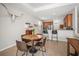 Bright dining area near the kitchen with barstool seating and an open layout at 358 River Enclave Ct, Bradenton, FL 34212
