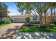 Inviting single-story home featuring a brick paver driveway and a two-car garage at 358 River Enclave Ct, Bradenton, FL 34212