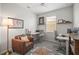 Comfortable office space with modern desks, a leather chair, and bright lighting perfect for a productive work environment at 358 River Enclave Ct, Bradenton, FL 34212