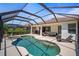 Beautiful screened-in pool and spa, with ample patio seating, perfect for outdoor relaxation and entertainment at 358 River Enclave Ct, Bradenton, FL 34212