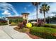 Well maintained tennis center entrance with lush landscaping at 358 River Enclave Ct, Bradenton, FL 34212