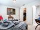 A bedroom with neutral paint and hardwood flooring featuring a closet and ensuite bathroom at 3602 Beneva Rd # 405, Sarasota, FL 34239