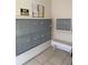 Mailboxes for residents in a well-lit entryway with posted community information at 3602 Beneva Rd # 405, Sarasota, FL 34239