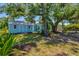 Expansive backyard with a shed, mature trees, and ample space for outdoor activities at 3728 Rilma Ave, Sarasota, FL 34234
