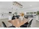 Open floorplan showcasing the kitchen, dining area, and living space, creating a seamless and modern living experience at 3856 Monica Pkwy, Sarasota, FL 34235