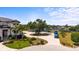 Circular driveway provides ample parking and boat storage with lush landscaping, with river views at 408 Inlet Rd, Ruskin, FL 33570
