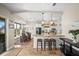 Open kitchen boasts stainless steel appliances, breakfast bar seating, and adjacent dining area at 408 Inlet Rd, Ruskin, FL 33570