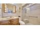 Bright bathroom with a glass enclosed shower, vanity and toilet at 4131 Salernes Ave # 3051, Sarasota, FL 34233