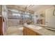 Updated bathroom featuring tiled shower with glass door and granite countertop at 4131 Salernes Ave # 3051, Sarasota, FL 34233