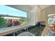 Kitchen with views of the lake and lush greenery provides a serene backdrop for culinary tasks at 4131 Salernes Ave # 3051, Sarasota, FL 34233