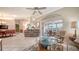 Spacious living area features tile floors and seamless flow into the adjacent dining and sunroom at 4131 Salernes Ave # 3051, Sarasota, FL 34233