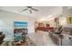 Comfortable living area with tile flooring, a ceiling fan, and plenty of natural light for a bright atmosphere at 4131 Salernes Ave # 3051, Sarasota, FL 34233