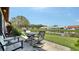 Outdoor patio overlooking a serene pond, great for relaxing and entertaining guests at 4131 Salernes Ave # 3051, Sarasota, FL 34233