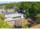Aerial view of the home's backyard featuring a shaded patio area with a table and chairs at 4243 Maceachen Blvd, Sarasota, FL 34233
