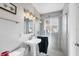 Modern bathroom with a glass-enclosed shower, sleek vanity, and stylish lighting fixtures at 4243 Maceachen Blvd, Sarasota, FL 34233