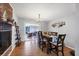 Comfortable dining room with hardwood floors, stylish decor, and a view of the living room at 4243 Maceachen Blvd, Sarasota, FL 34233