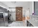 Spacious kitchen featuring stainless steel appliances, ample counter space, and a brick accent wall at 4243 Maceachen Blvd, Sarasota, FL 34233