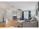 Inviting living room featuring hardwood floors, ample natural light, and stylish decor at 4243 Maceachen Blvd, Sarasota, FL 34233