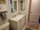 Bathroom vanity with storage, mirror and toilet at 425 30Th W Ave # C104, Bradenton, FL 34205