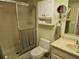 Bathroom featuring shower, toilet, vanity, and storage cabinet at 425 30Th W Ave # C104, Bradenton, FL 34205