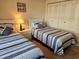 Bedroom featuring two beds with matching decor at 425 30Th W Ave # C104, Bradenton, FL 34205