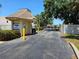 Entrance gate to Woodbriar Villas shows the guard house and security gate at 425 30Th W Ave # C104, Bradenton, FL 34205