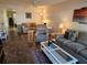Cozy living room with neutral tones, comfortable seating, and plenty of natural light at 425 30Th W Ave # C104, Bradenton, FL 34205