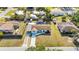 Aerial view of a single-Gathering home with a long driveway and mature trees in a residential neighborhood at 432 Crosby Ct, Sarasota, FL 34237