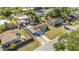Bird's eye view of the home featuring an expansive driveway, fenced yard and carport at 432 Crosby Ct, Sarasota, FL 34237