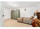 Neutral bedroom with a twin bed, folding screen, and tile flooring at 432 Crosby Ct, Sarasota, FL 34237