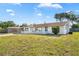 A charming single-story home with a well-manicured lawn and a cozy front porch area at 432 Crosby Ct, Sarasota, FL 34237