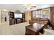 Inviting living room featuring tile floors, a ceiling fan, and a large window for ample natural light at 432 Crosby Ct, Sarasota, FL 34237