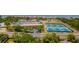 An aerial view showcasing well maintained tennis courts, nestled within the vibrant community landscape at 4510 El Conquistador Pkwy # 105, Bradenton, FL 34210
