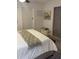 Bright bedroom featuring neutral tones, comfortable bedding, and cozy decor at 4510 El Conquistador Pkwy # 105, Bradenton, FL 34210